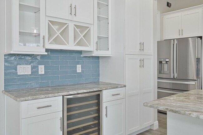 Building Photo - NOW AVAILABLE - Gorgeous Pool Home ~ NW Cape ~ 3 Car Garage ~ On Canal!