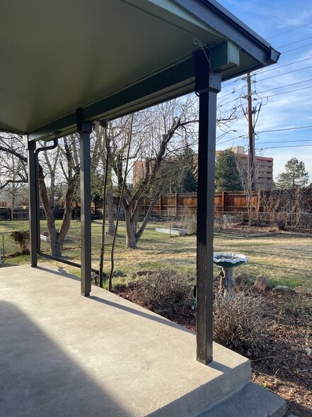 Relaxing back patio open to large backyard - 7991 E Hampden Cir