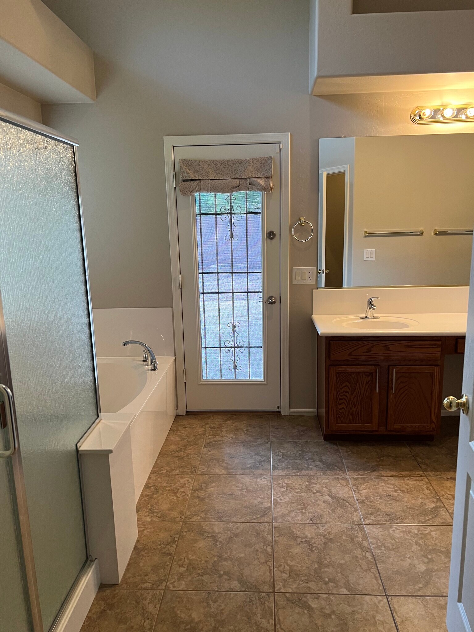 Primary bath dual sinks exit to backyard. - 40781 W Walker Way