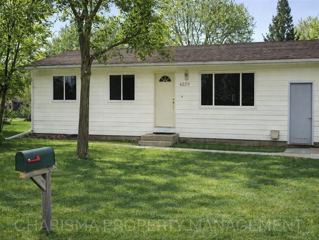 Building Photo - 4 BD, 2 BA - FENCED IN YARD, PRIVATE TRAILS, FINISHED UPPER AND LOWER LIVING AREAS, ATTACHED GARAGE!