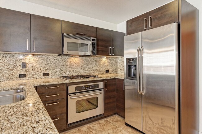 Building Photo - Modern Downtown Condo in Premier High-Rise...