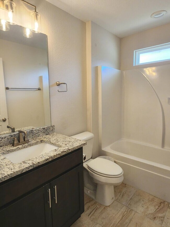 Building Photo - Welcome to this stunning 4-bedroom, 3-bath...