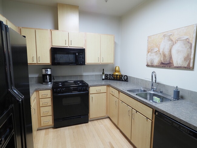 Well equipped kitchen with a gas stovetop and oven. - 2408 Main St