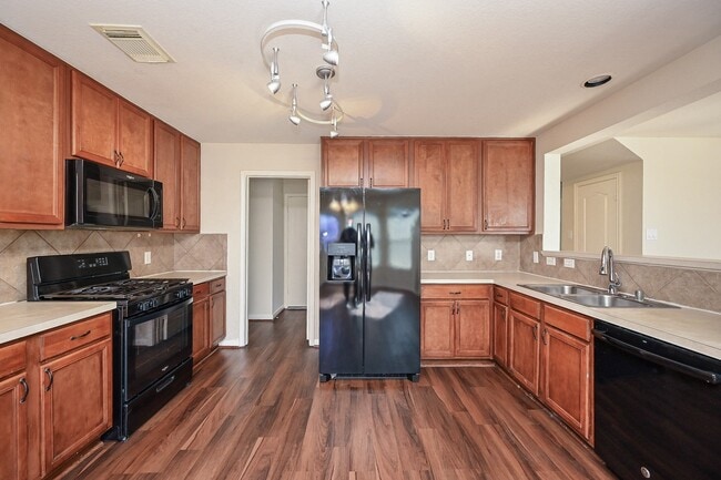 Building Photo - 9403 Coatsworth Dr