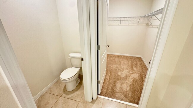 Building Photo - Available NOW! Spacious 4BD/2BA Haven in Villages at Harmony – Your Dream Home Awaits! WASHER & D...