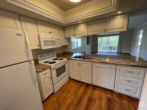 Building Photo - ANNUAL RENTAL - 3 BED / 2 BATH WITH CARPOR...