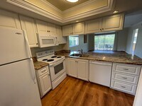 Building Photo - ANNUAL RENTAL - 3 BED / 2 BATH WITH CARPOR...