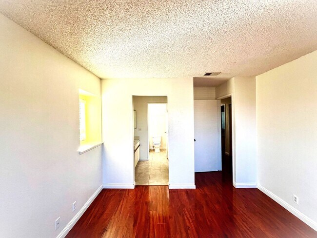 Building Photo - 2-Bedroom, 2-Bath Upstairs Condo Unit in Gated Pomona Community, Water/Trash/HOA Included!