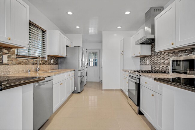 Building Photo - Stunning Remodeled Corner-Lot Home – An En...