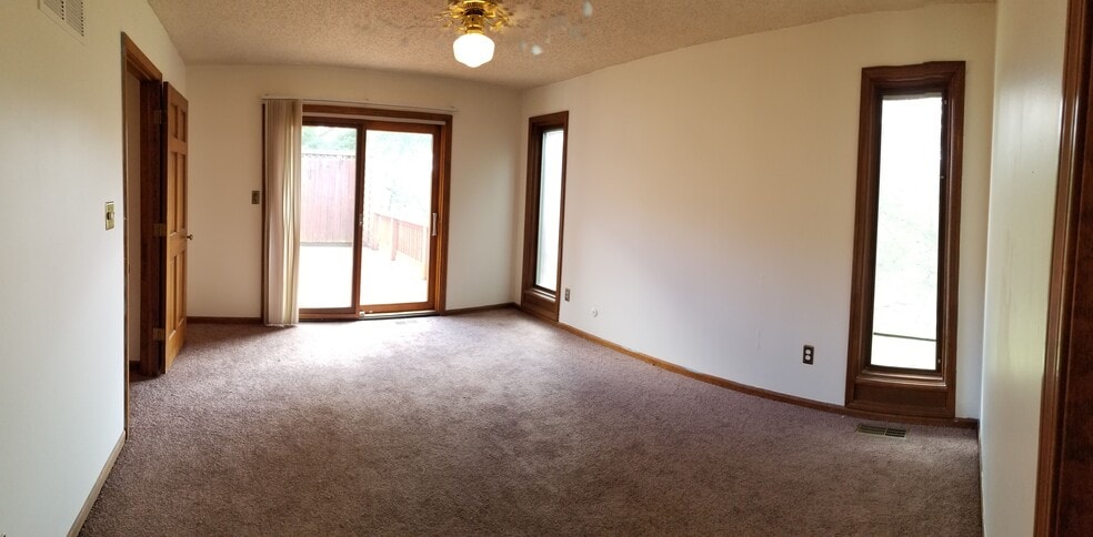Master Bedroom - Upstairs - view looking at deck - 3023 University Dr