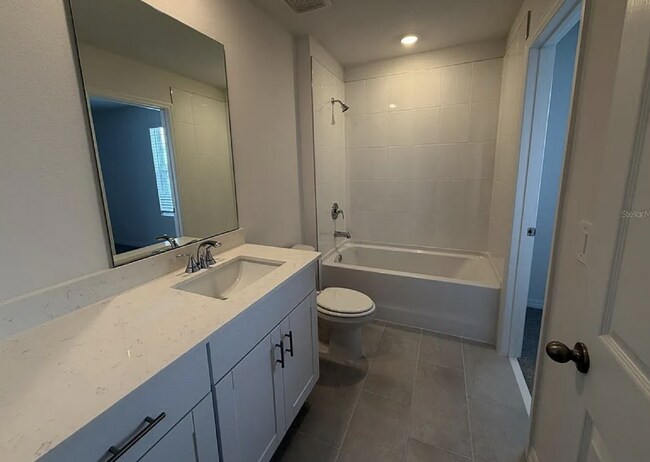 Building Photo - "Spacious 3-Bedroom Townhouse with Granite Elegance in St. Cloud – 4543 Rangeland Way"