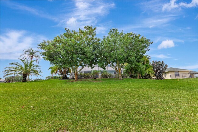 Building Photo - A BOATER'S PARADISE WITH THIS STUNNING 3 BEDROOM, 2 BATH WATERFRONT POOL HOME W/DOCK & BOAT LIFT ...