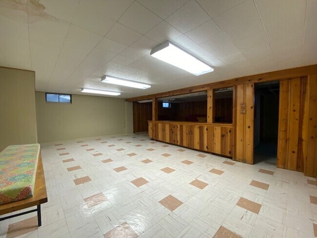 Building Photo - Welcome to this charming three-bedroom, tw...