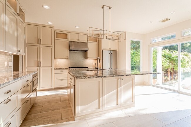 Building Photo - Gorgeous 4BR 2.5/BA Home with White Kitchen & Tree-Filled Yard