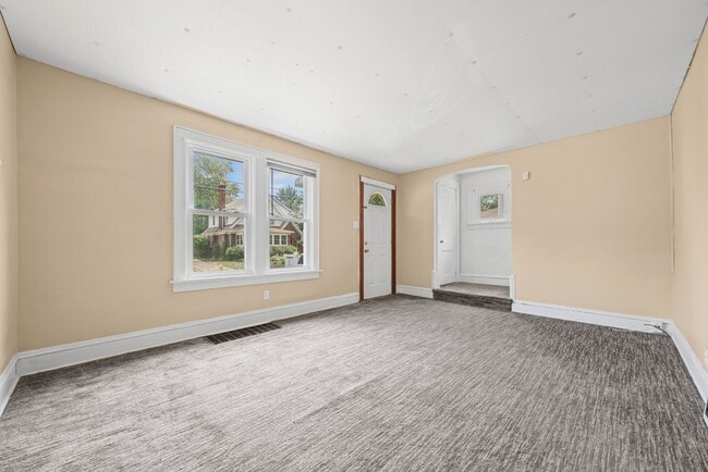 Building Photo - Bright living ? cozy dining flow for everyday comfort and easy entertaining.