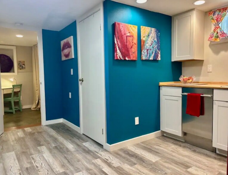 Kitchen, bathroom door, and office area. - 4115 SE Gladstone St