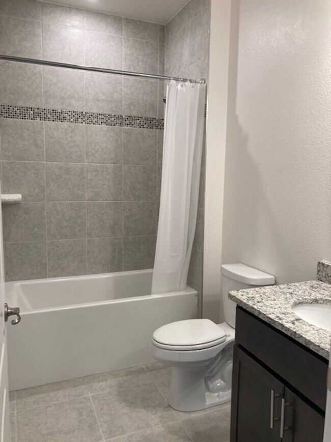 Building Photo - Like New 3 bedroom + den with French doors, screened in porch and Fenced yard and much more...