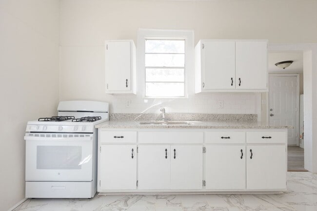 Building Photo - Move-In Special: Get 50% OFF Your First Month's Rent!