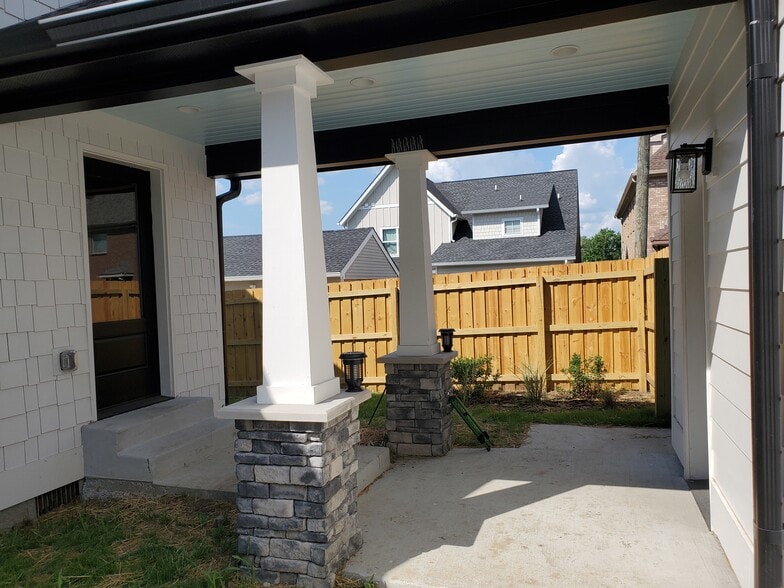 Covered walkway to detached garage keeps you out of the elements when coming and going! - 1021 Cheatham Pl