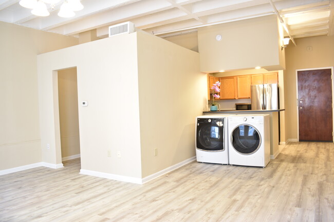 Left door to the closet and bathroom. Right door is the main entrance. Kitchen, and washer dryer - 32 Peachtree St NW