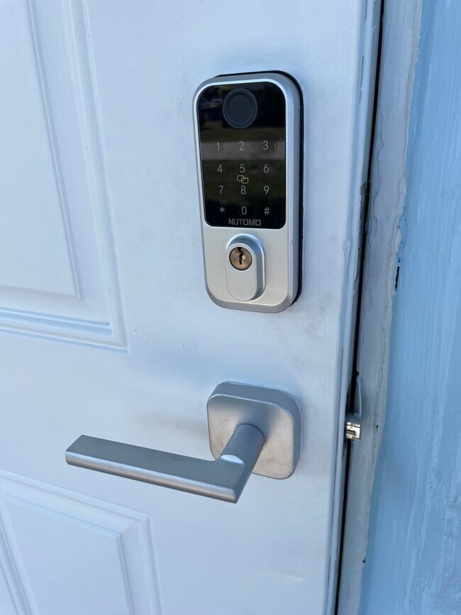 Front door can be opened by fingerprint, key code, key fob, or just a regular key! - 7669 SE James St