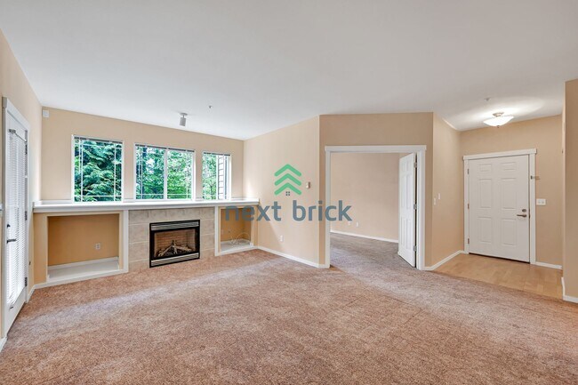 Building Photo - Rare Ground-Floor, End Unit with massive b...