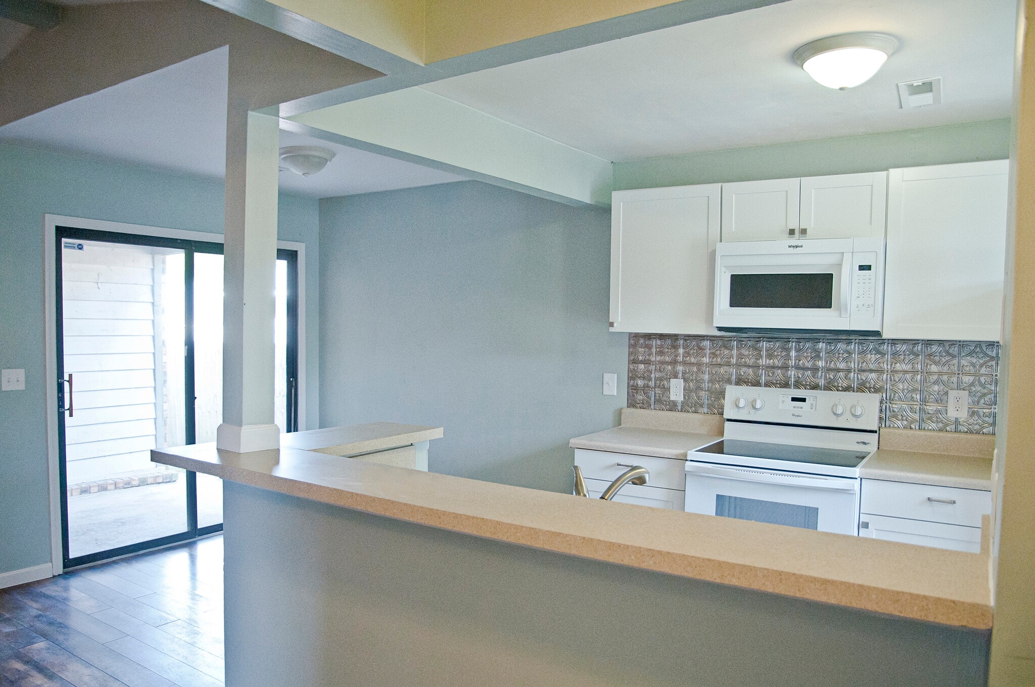 Kitchen and breakfast nook leading to private patio. - 409 Erskine St