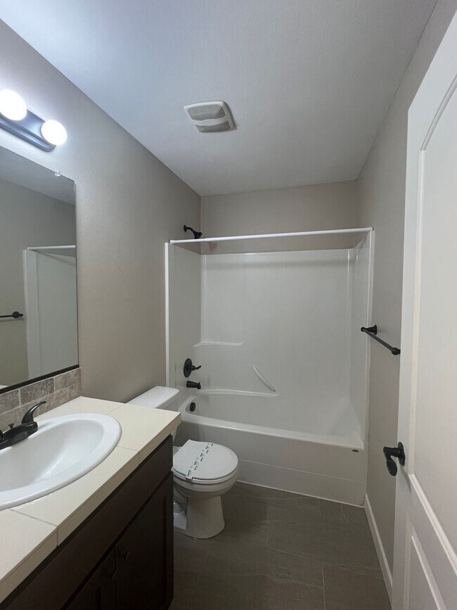 Building Photo - Recently Renovated! Spacious 3 Bedroom Home with Fenced Yard, Patio, and 2-Car Garage With Move I...