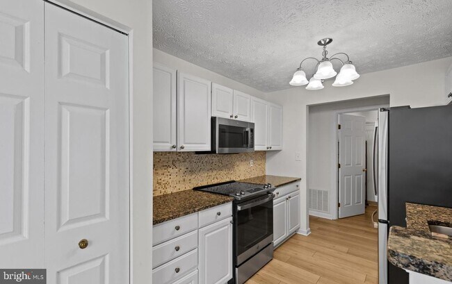 Building Photo - Welcome to Piney Orchard! This beautifully updated 2-bedroom, 2-bath condominium!