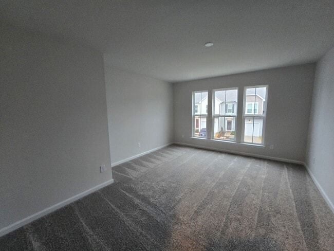 Building Photo - NEWLY BUILT END UNIT TOWNHOME