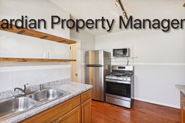 Building Photo - Linden Hills Side By Side, Hardwood Floors, Attached Garage, New Efficient Heating System, Pets W...