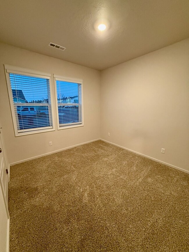 Building Photo - New Construction 4 Bed Mead School District Rancher w/ Fully-Fenced Yard and Attached Garage!