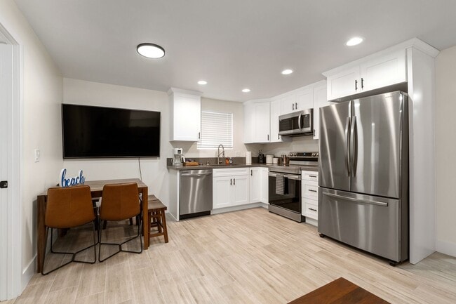 Building Photo - Beachside 3BR Home | Remodeled | AC | Garage Parking | Walk to Boardwalk