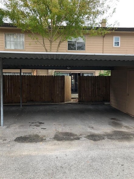 Two-car covered garage with permanent assigned parking - 7700 Creekbend Dr
