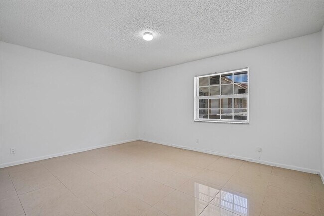 Building Photo - 3100 Coral Springs Dr