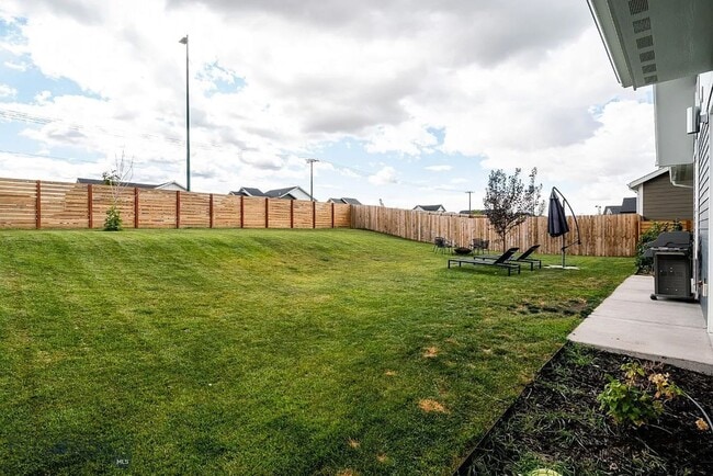 Building Photo - Charming Three Bedroom Home with Large Fenced Yard