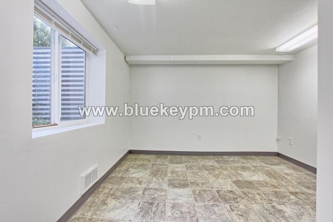 Building Photo - 4 Bedroom, 2 Bath Home with Primary on Main Floor, Basement and Large Fenced Yard