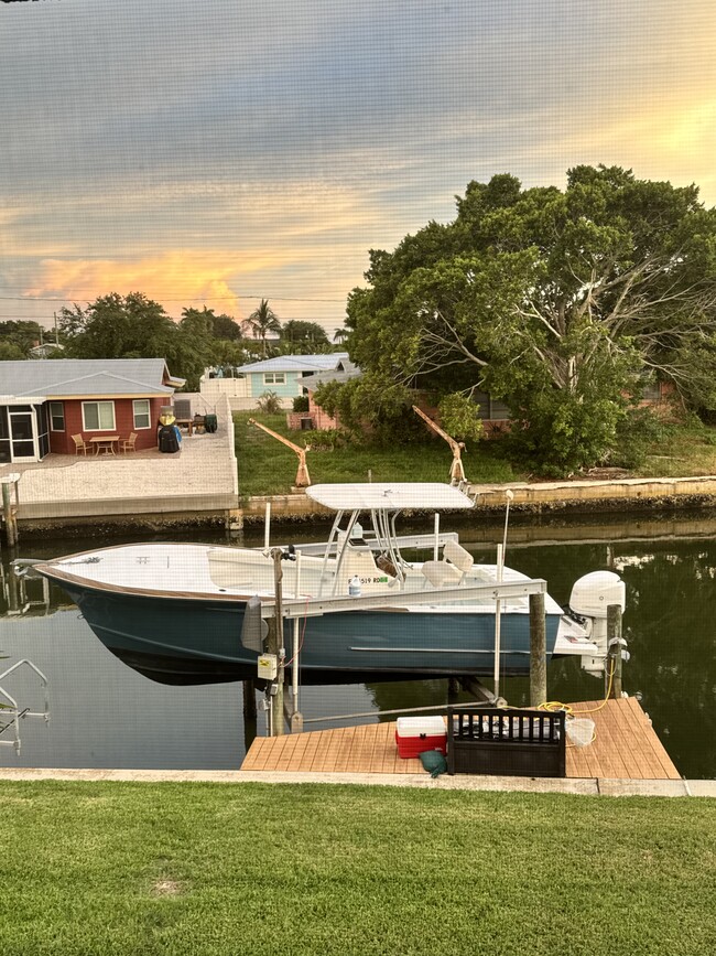 13000 lb boat lift, dock with fresh water line - 10309 Waterbird Way