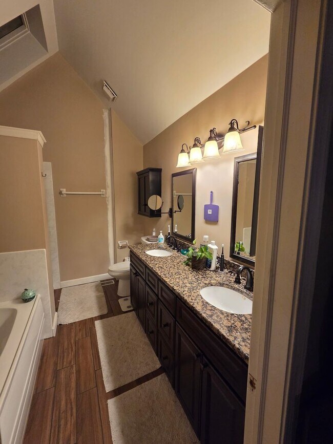 Building Photo - Stunning 3–4 Bedroom Townhome in Private Community | Garage + EV Charger | Deck with Tree Views
