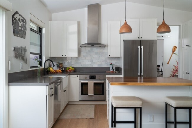 Building Photo - Elevated Haiku Retreat with Ocean Views, Designer Finishes & a Lush Edible Garden Sanctuary