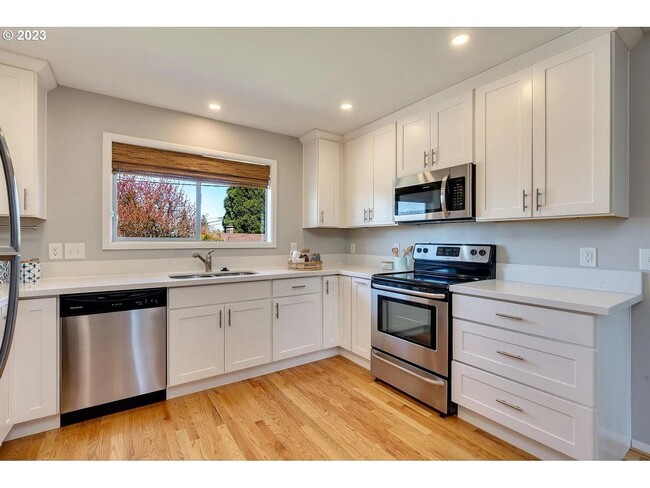 Building Photo - Stylishly Updated Mid-Century Gem on a Qui...