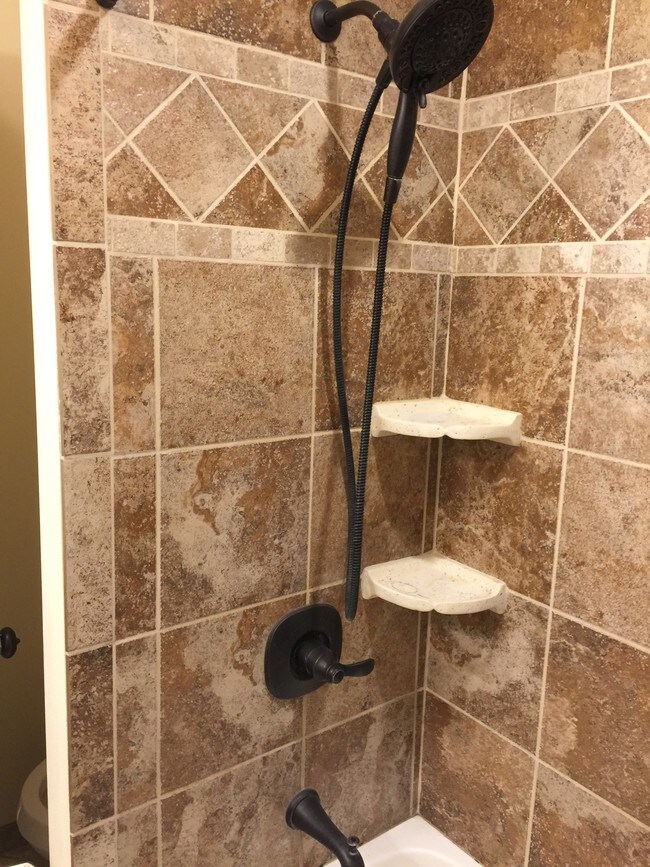 Bathroom shower head/shelves - 23 E 6th St