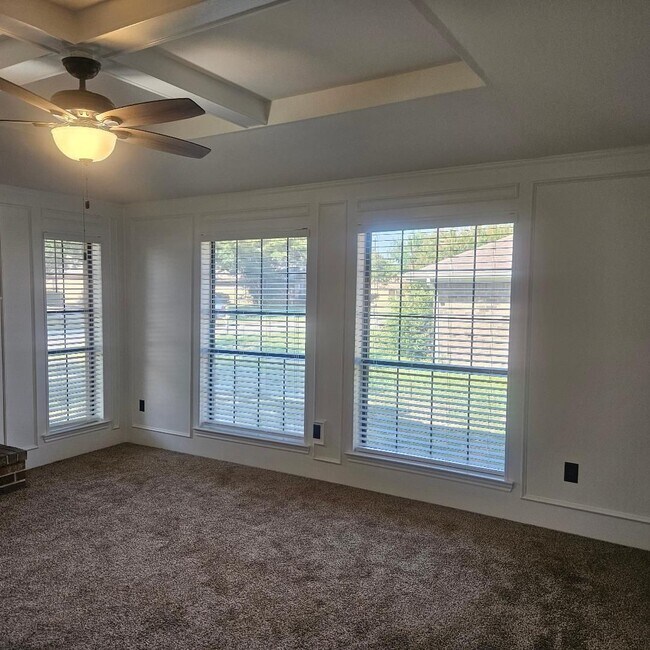 Building Photo - Three bedroom and two bathroom nicely remodeled with new flooring. Large wood fenced backyard