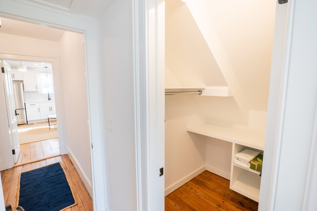 Walk-in closet with built-in storage. - 208 Ashley Ave