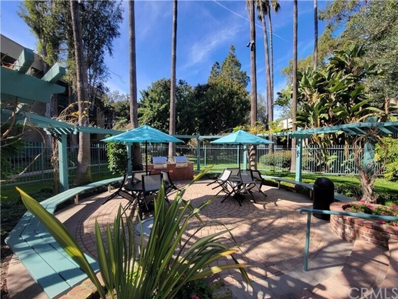 Barbecue area around pool area - 436 N Bellflower Blvd
