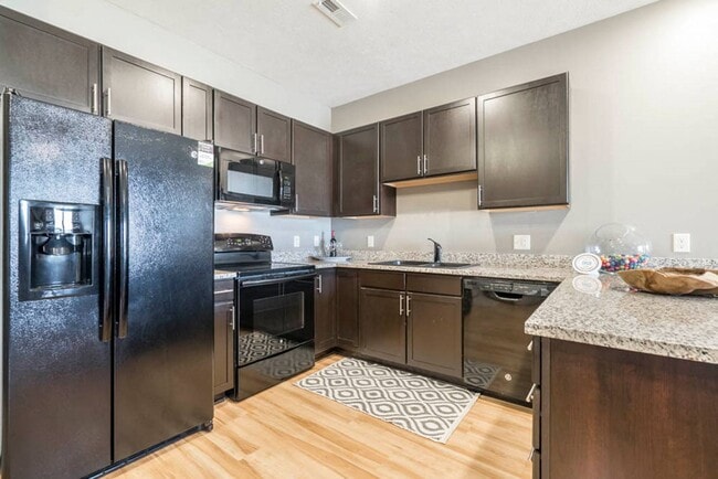 Modern conveniences, open layouts, and comfortable living come together at The Flats at 84. - The Flats at 84