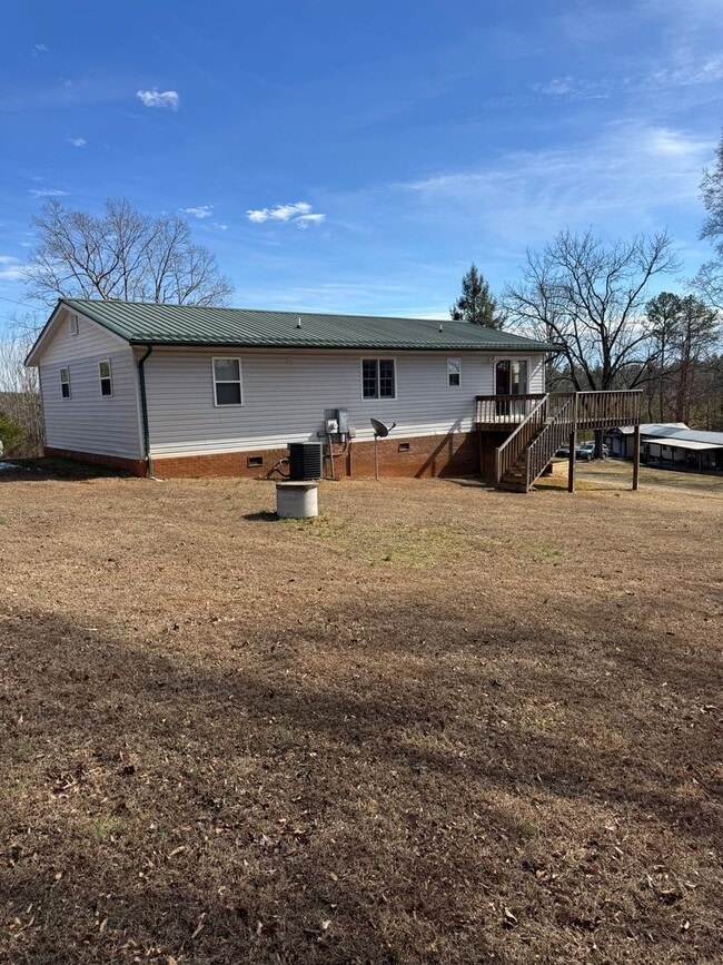 Building Photo - Spacious 4-Bedroom Rural Home on Private Acreage