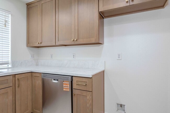 Building Photo - Gated Townhome with Updated Kitchen and Private Backyard