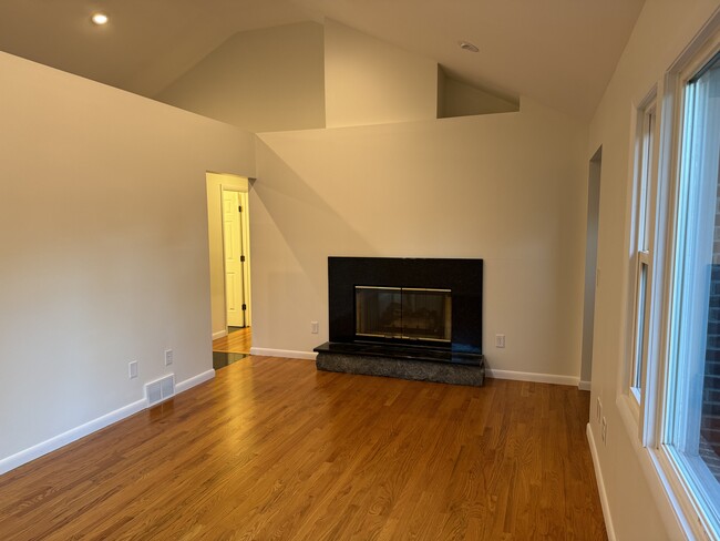 Large great room with cathedral ceilings, recessed lighting, and ceiling fans - 594 Albany Shaker Rd