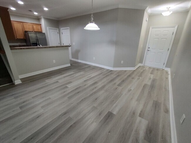 Building Photo - BRAND NEW FLOORING & FRESH PAINT - 3 Bedroom/2.5 Bath Townhome with garage in Wild Wing!